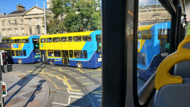 3 identical double decker buses. Photo taken from another bus of the same type