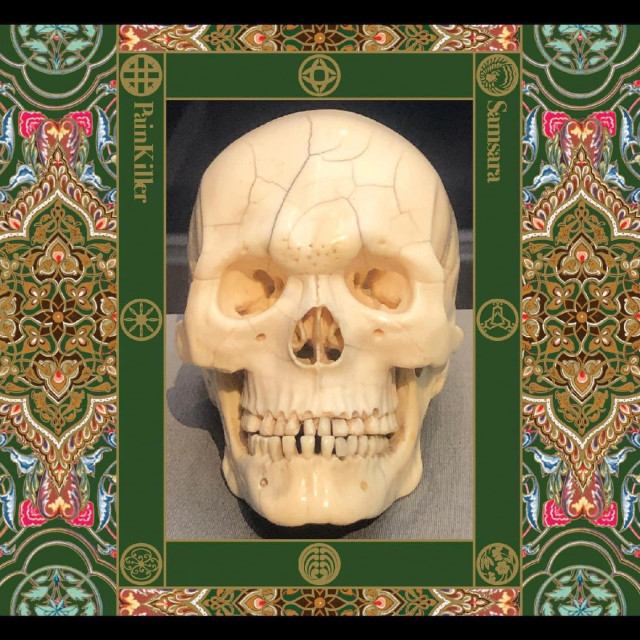 Mockup of the new Painkiller album is a cracked skull bordered by an ornate flower wallpaper pattern.