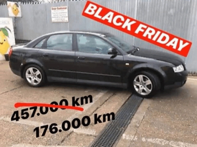 photo of 90s audi sedan labeled black friday, with crossed out 457000km and 176000km next to it