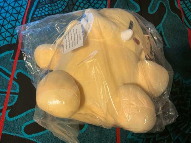 My Mastodon Plushie in a clear bag after it was delivered.