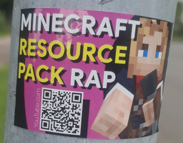 A picture of a sticker with the following text on it “Minecraft Resource Pack Rap” with a QR code and a blocky, pixelated Minecraft character singing into a microphone

The QR code leads to https://youtu.be/pqqLxtn983g