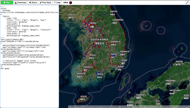 A satellite map of South Korea overlaid with cycling infrastructure. On the left is a frame containing an Overpass Ultra style + query.