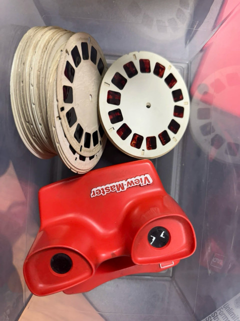 A View-Master with several reels in a plastic box